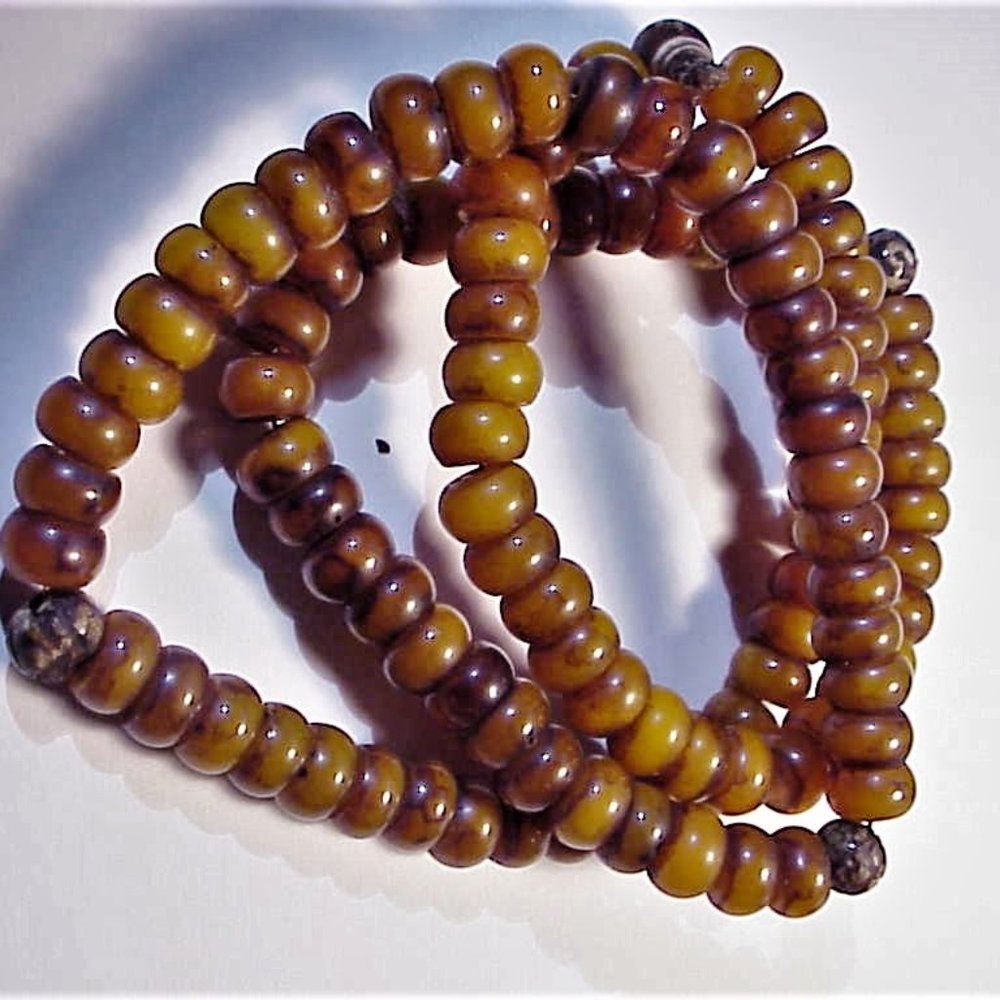 DOUBLE STRAND OF COPAL AMBER BEADS